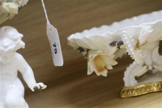 A Moore Bros white-glazed comport with cherub support and a tazza
